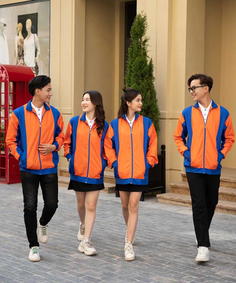 Đồng phục áo khoác gió Warm Up màu cam phối xanh dương