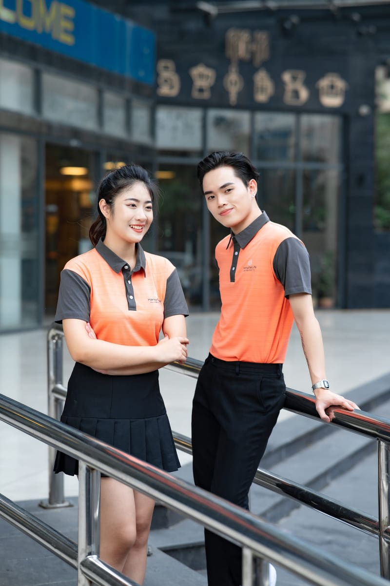 Áo đồng phục doanh nghiệp màu cam phối xám